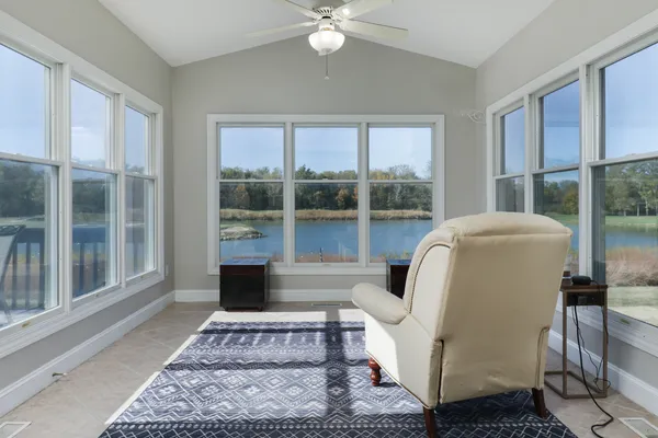 a bedroom with a bed and a bookshelf with wooden floor