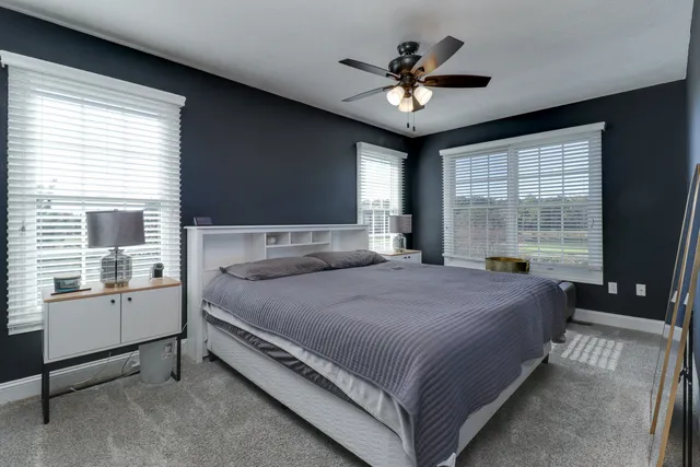 a kitchen with a refrigerator a sink and cabinets