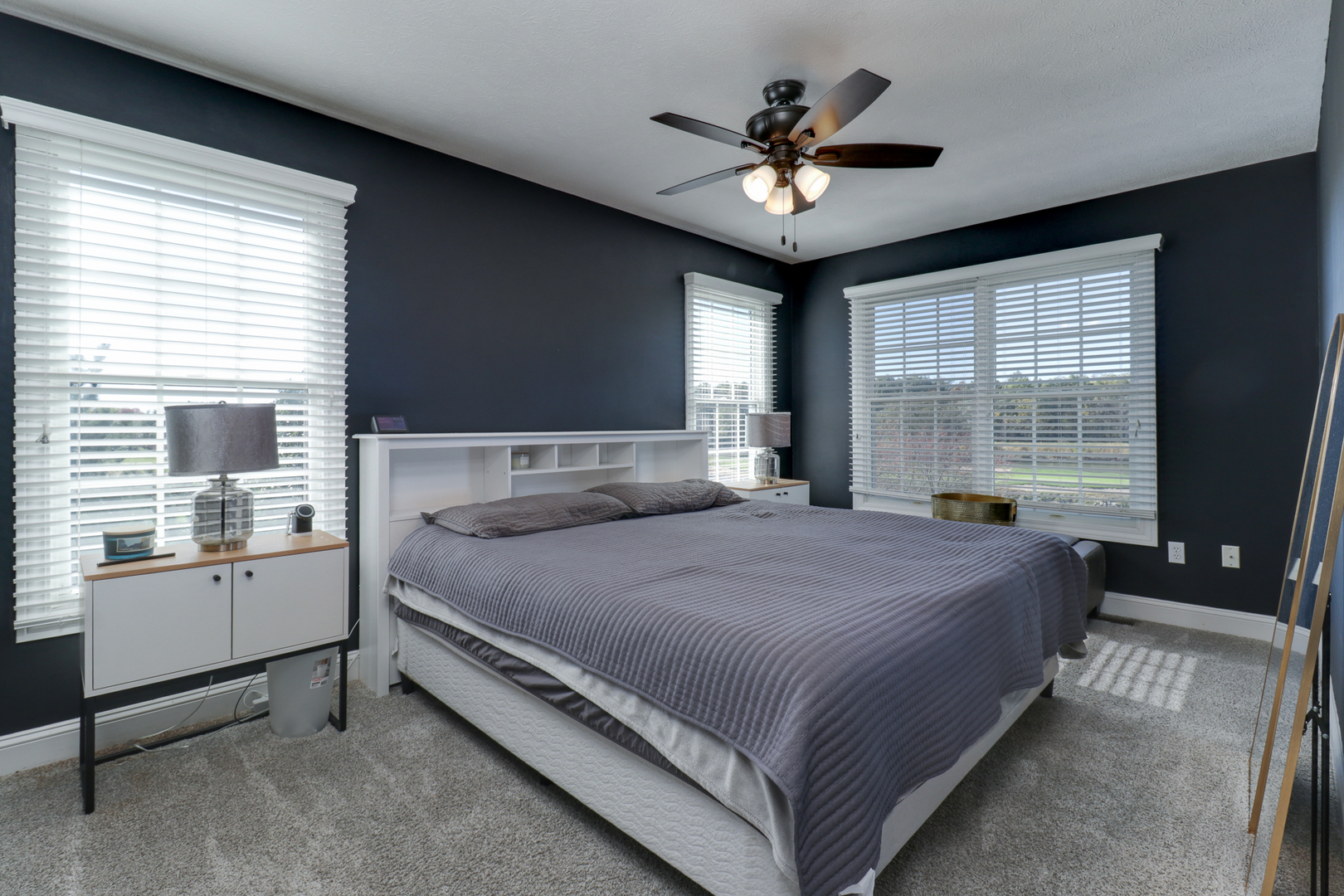 3 Pebblebrook Court Bloomington, IL 61705 - Photo 33 of 89 a large bed sitting in a bedroom next to a window