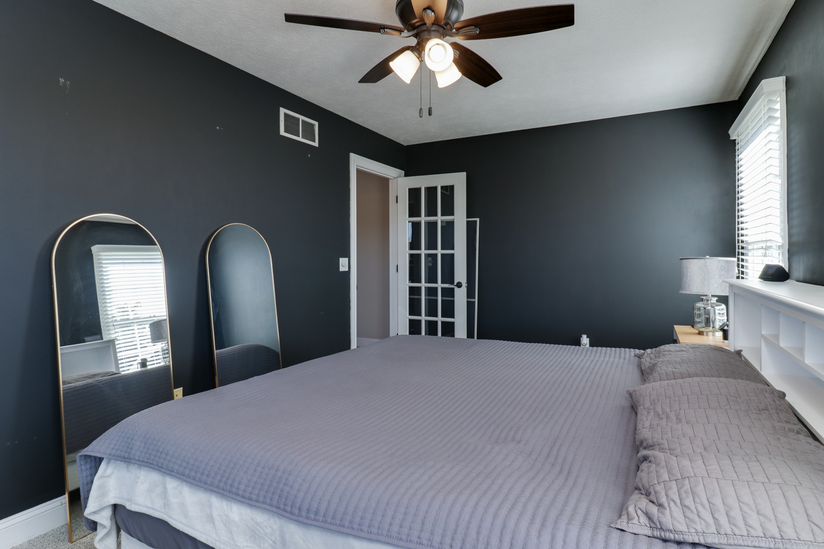 3 Pebblebrook Court Bloomington, IL 61705 - Photo 35 of 89 a bedroom with a bed and ceiling fan