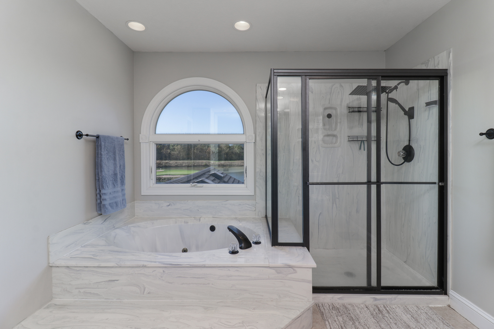 3 Pebblebrook Court Bloomington, IL 61705 - Photo 38 of 89 a bathroom with a bathtub and a shower