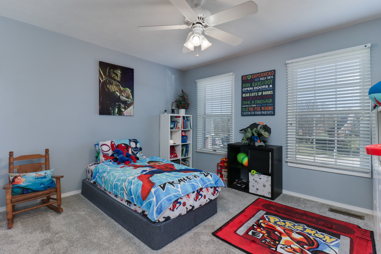 3 Pebblebrook Court Bloomington, IL 61705 - Photo 39 of 89 a bedroom with a bed and a bookshelf with wooden floor