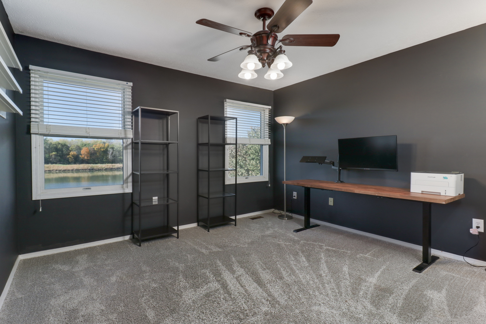3 Pebblebrook Court Bloomington, IL 61705 - Photo 42 of 89 a living room with furniture and a flat screen tv