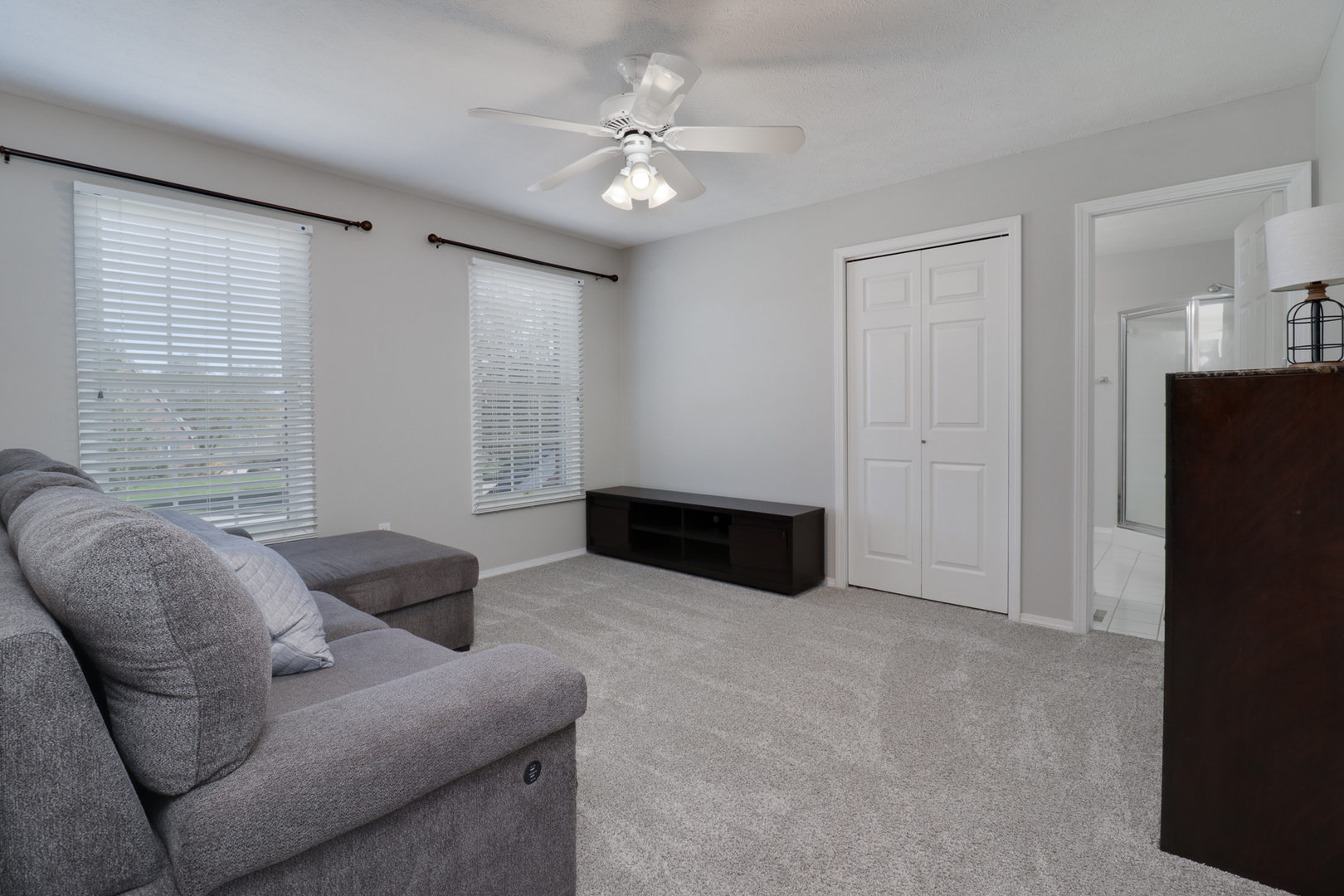 3 Pebblebrook Court Bloomington, IL 61705 - Photo 44 of 89 a living room with furniture and a ceiling fan