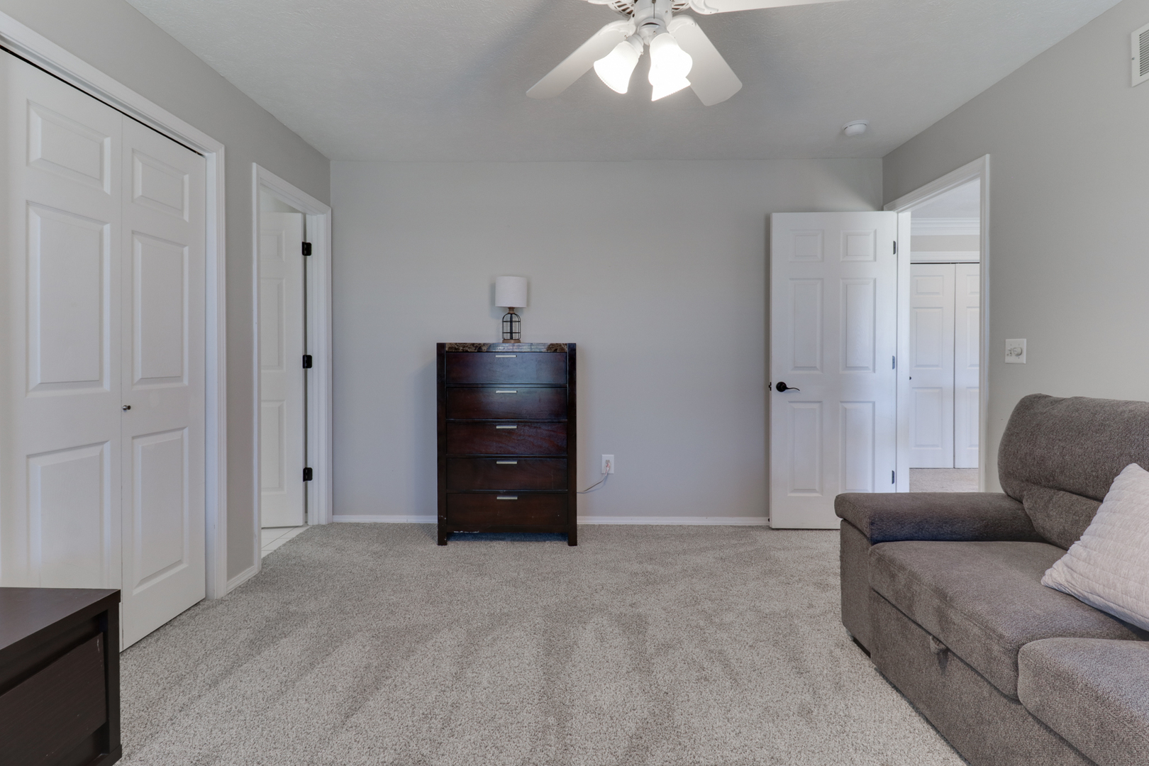 3 Pebblebrook Court Bloomington, IL 61705 - Photo 45 of 89 a living room with furniture and a chandelier