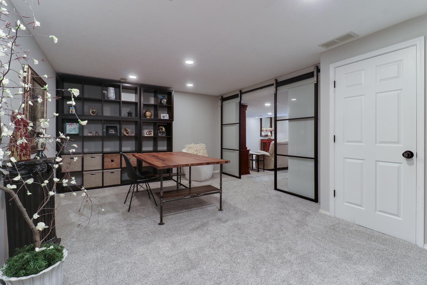 3 Pebblebrook Court Bloomington, IL 61705 - Photo 48 of 89 a view of a livingroom with furniture and a bookshelf
