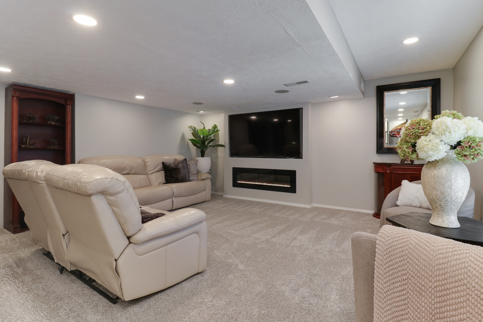 3 Pebblebrook Court Bloomington, IL 61705 - Photo 52 of 89 a living room with furniture and a flat screen tv