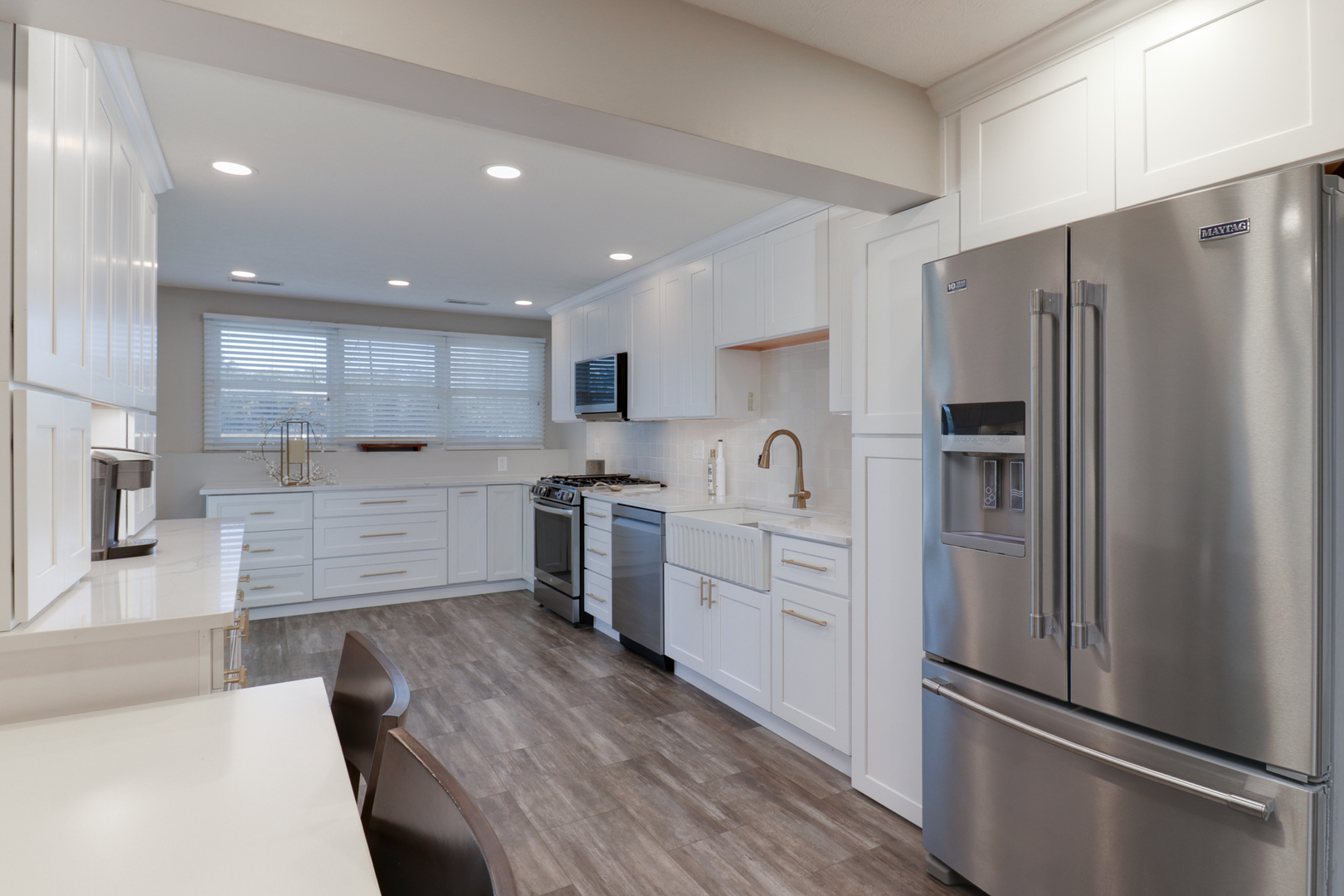 3 Pebblebrook Court Bloomington, IL 61705 - Photo 55 of 89 a kitchen with a refrigerator a sink and cabinets