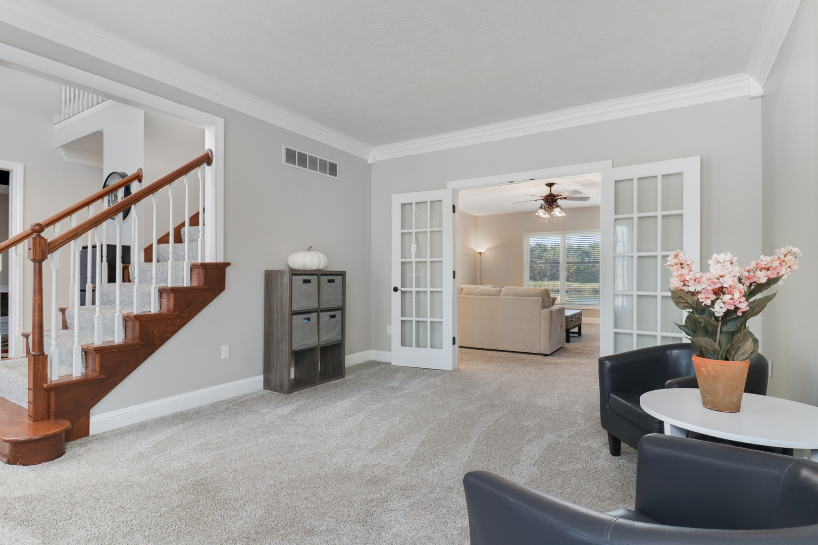 3 Pebblebrook Court Bloomington, IL 61705 - Photo 6 of 89 a living room with furniture and a potted plant