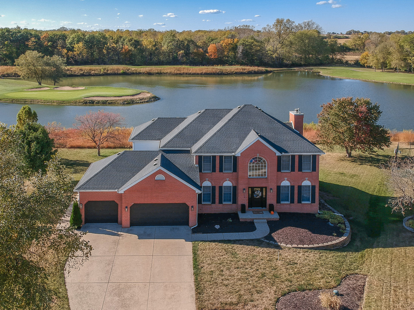 3 Pebblebrook Court Bloomington, IL 61705 - Photo 83 of 89 a aerial view of a house with a yard and a lake view