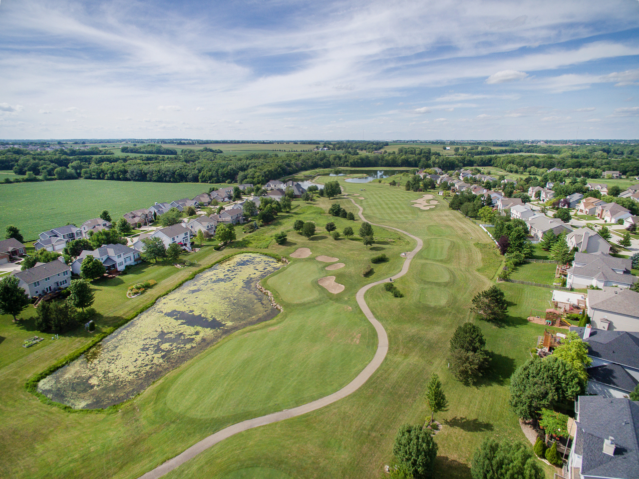 3 Pebblebrook Court Bloomington, IL 61705 - Photo 88 of 89 an aerial view of a golf course with a lake view