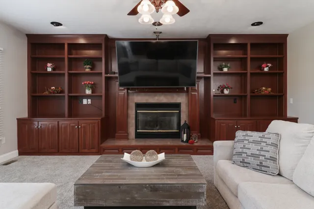a kitchen with granite countertop a refrigerator stove top oven a sink and dishwasher