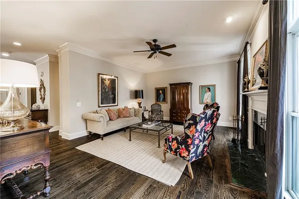 a living room with furniture flat screen tv and a fireplace