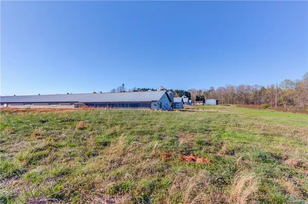 a view of a field with an outdoor space