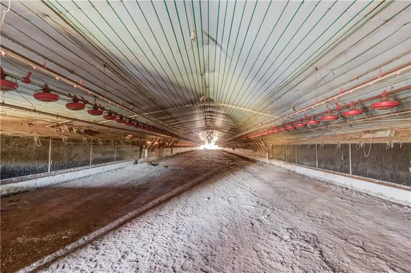 an empty room with wooden floor