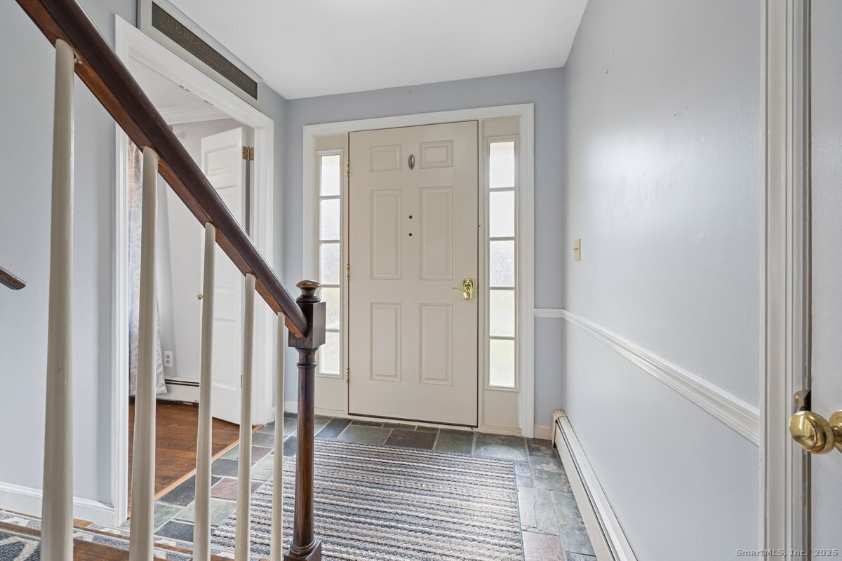95 Ridgewood Road Ridgefield, CT 06877 - Photo 2 of 31 a view of an entryway with staircase