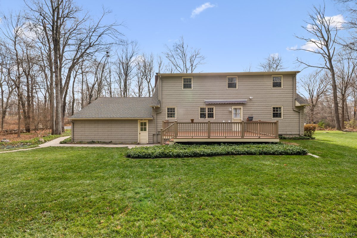 95 Ridgewood Road Ridgefield, CT 06877 - Photo 27 of 31 a view of a house with a back yard