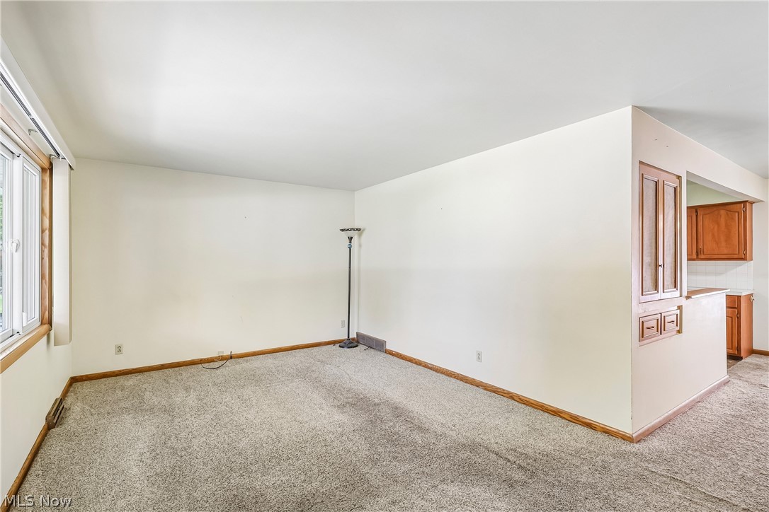 2758 Shellhart Road Norton, OH 44203 - Photo 5 of 41 Living room with large picture window and carpet flooring
