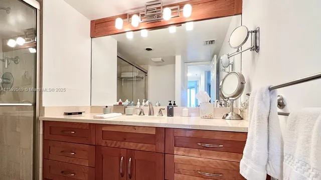 a bathroom with a double vanity sink mirror and double