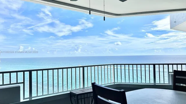 a balcony view with a garden