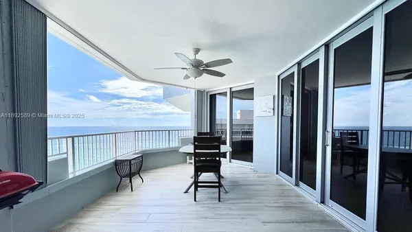 a view of workspace with wooden floor and windows