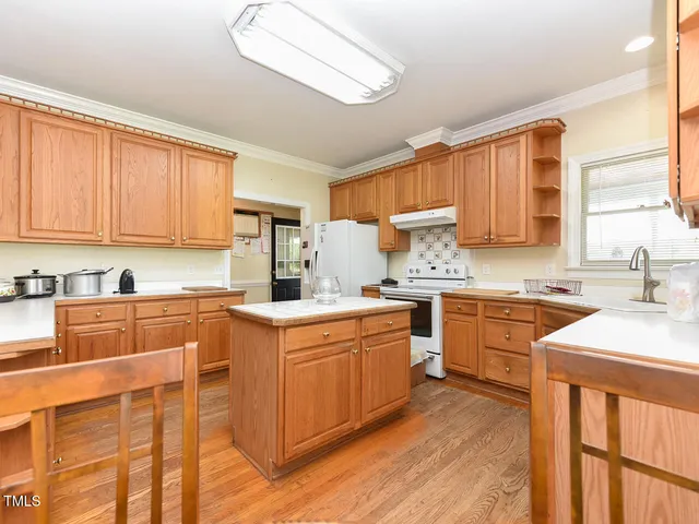 a kitchen with stainless steel appliances granite countertop a sink and cabinets