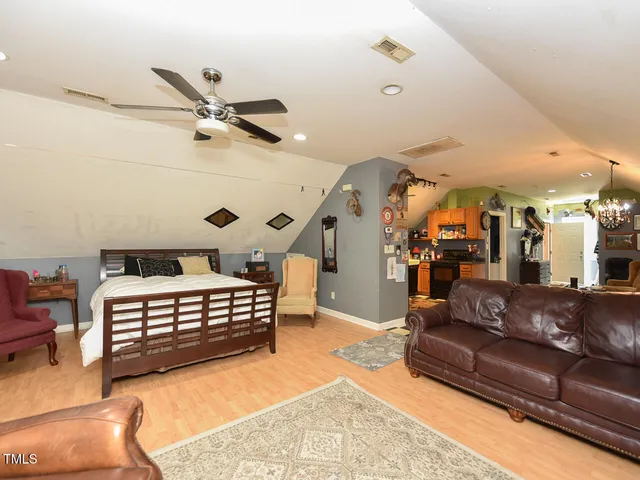 a view of a porch with furniture and garden