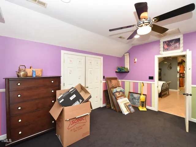 a front view of a house with a yard table and chairs
