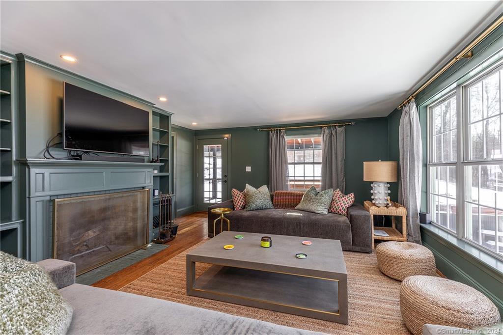 63 Cemetery Hill Road Cornwall, CT 06796 - Photo 16 of 45 a living room with furniture a flat screen tv and a fireplace