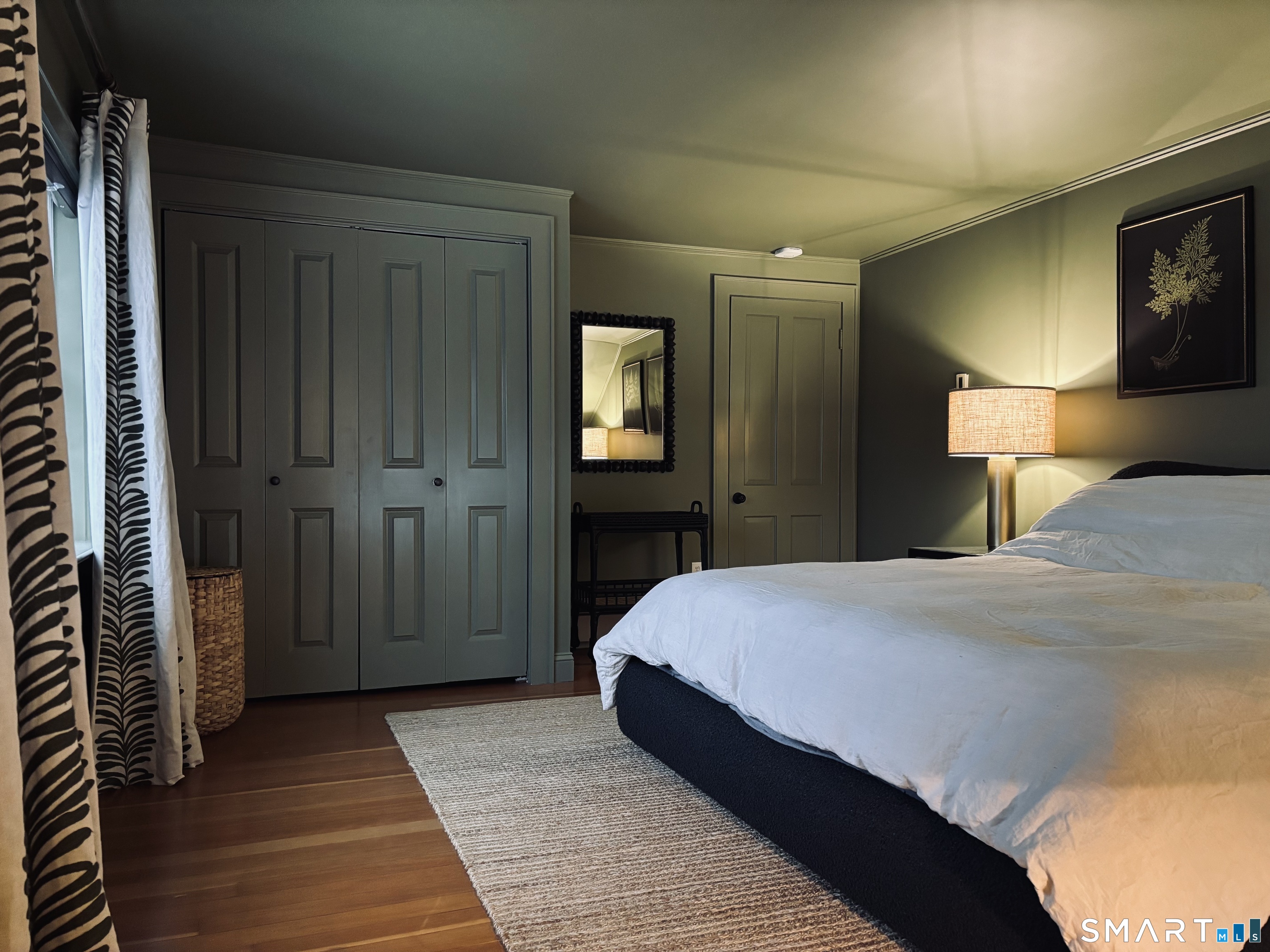 63 Cemetery Hill Road Cornwall, CT 06796 - Photo 28 of 45 a bedroom with a bed and a lamp on table