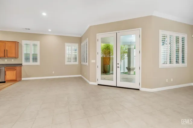 a kitchen with stainless steel appliances a stove a sink cabinets and a kitchen counter top