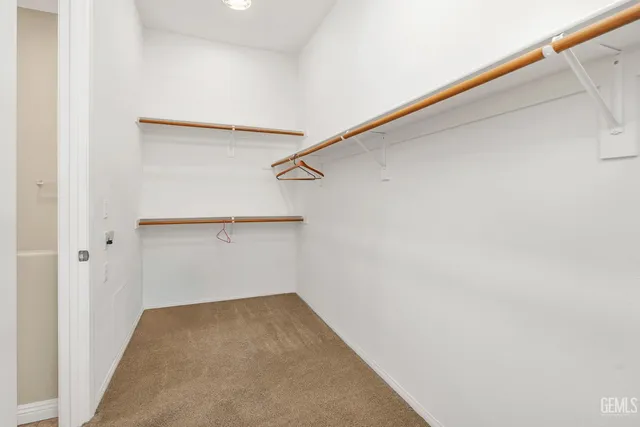 an aerial view of residential houses with outdoor space and swimming pool