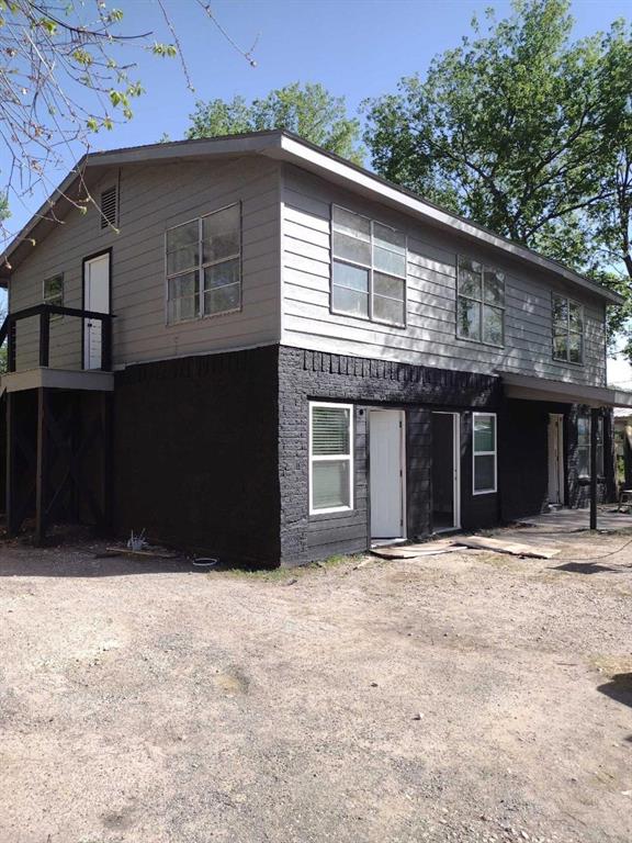 9205 Georgian Drive, Unit A2 Austin, TX 78753 - Photo 1 of 8 a front view of a house with a yard
