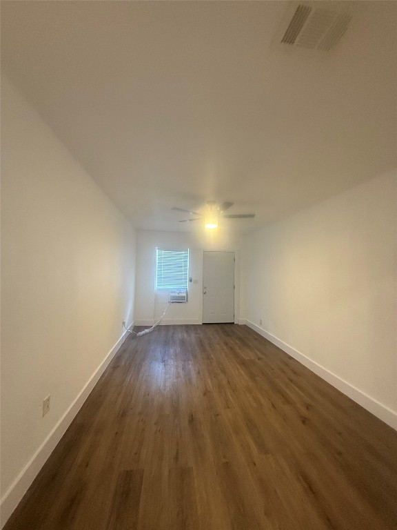 9205 Georgian Drive, Unit A2 Austin, TX 78753 - Photo 4 of 8 an empty room with wooden floor and windows