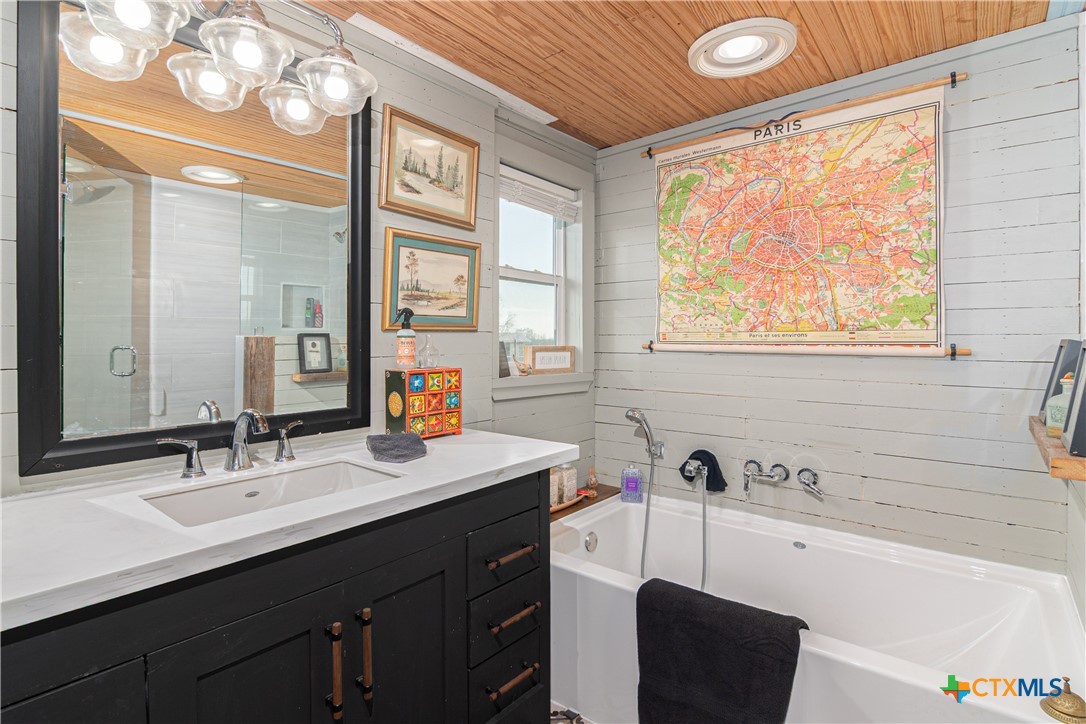 7150 Linne Road Seguin, TX 78155 - Photo 11 of 43 a bathroom with a sink double vanity and a mirror