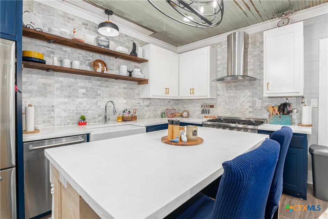 7150 Linne Road Seguin, TX 78155 - Photo 17 of 43 a kitchen with a wooden table and chairs