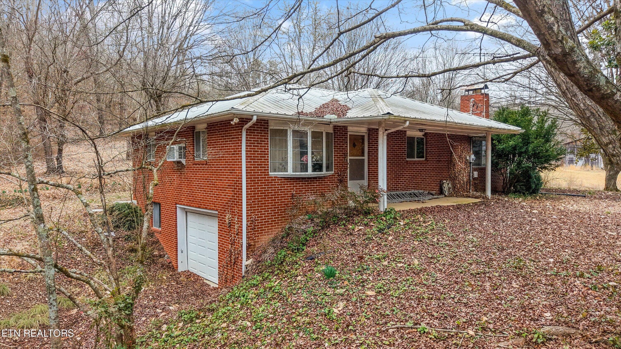 1201 Laurel Bluff Road Kingston, TN 37763 - Photo 3 of 21 front view of a house with a yard