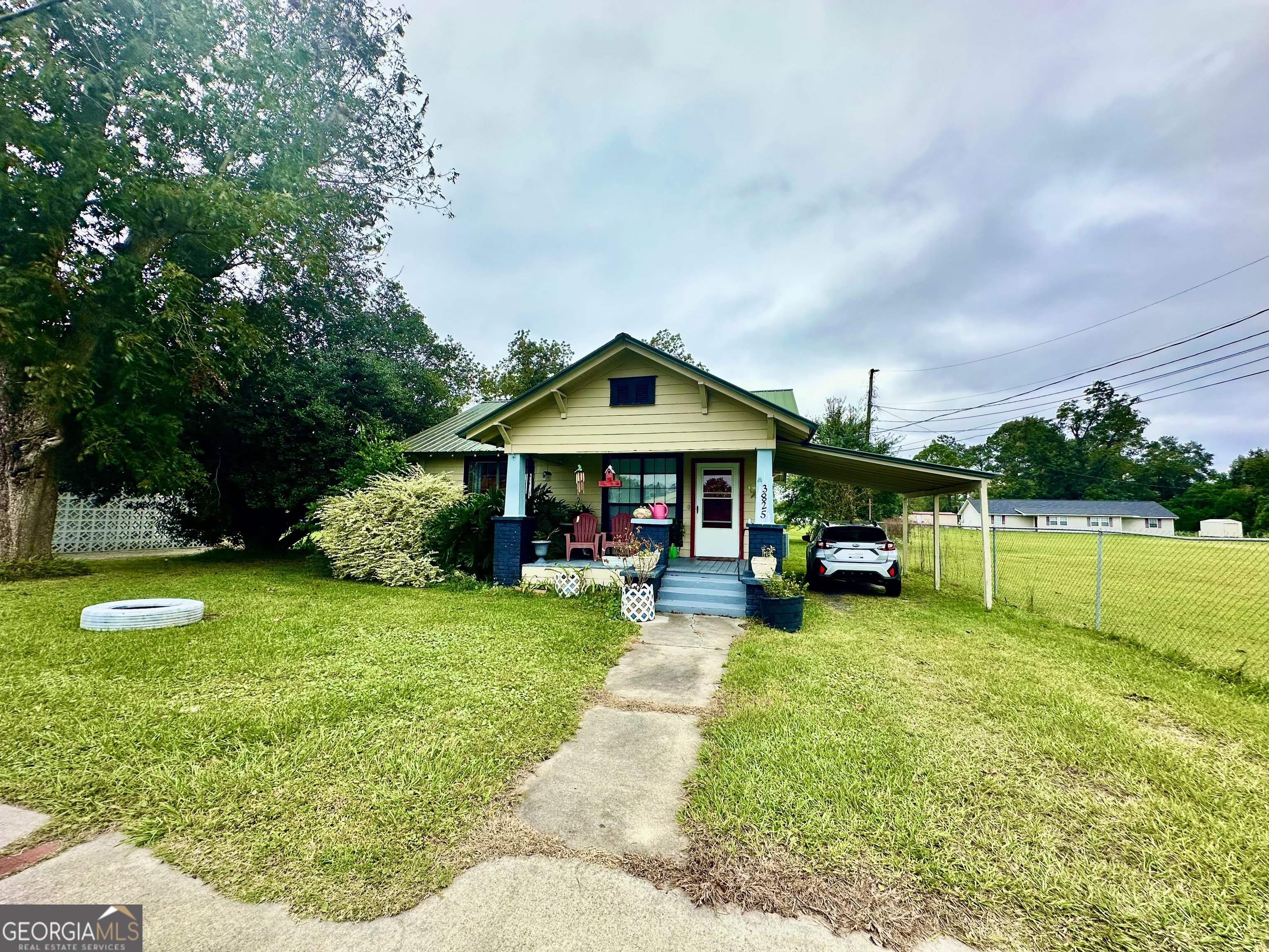 3825 Jamestown Road Waycross, GA 31503 - Photo 1 of 1 a view of a house with swimming pool and sitting area