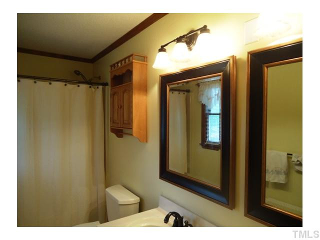 816 Hunters Run Road Mebane, NC 27302 - Photo 7 of 14 New fixtures and mirrors in master bath...