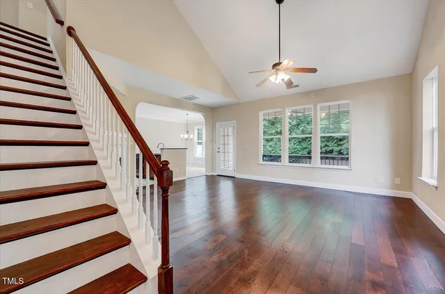 a picture of a wall with a white bed and a white wall