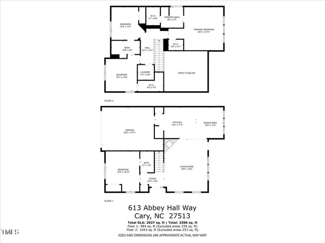 a view of a yard with plants and a bench