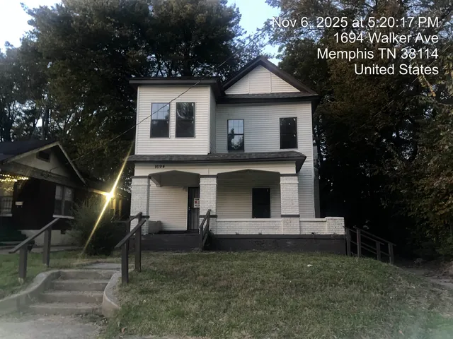 a front view of a house with garage