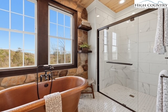 457 Autumn Leaf Way Crumpler, NC 28617 - Photo 21 of 37 a bath tub sitting next to a window