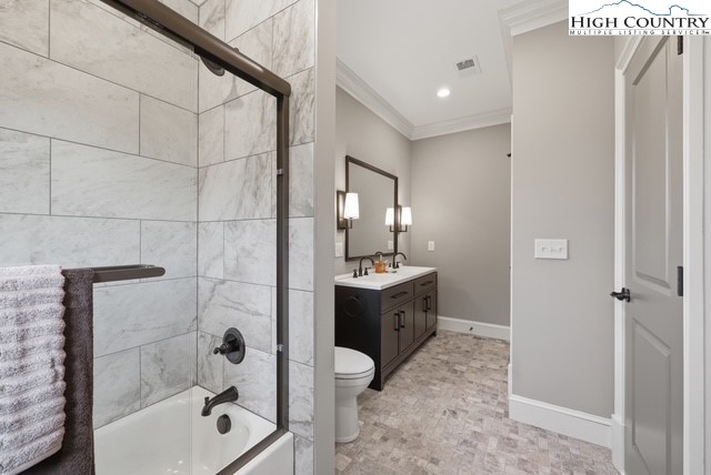 457 Autumn Leaf Way Crumpler, NC 28617 - Photo 30 of 37 a bathroom with a double vanity sink toilet mirror and shower