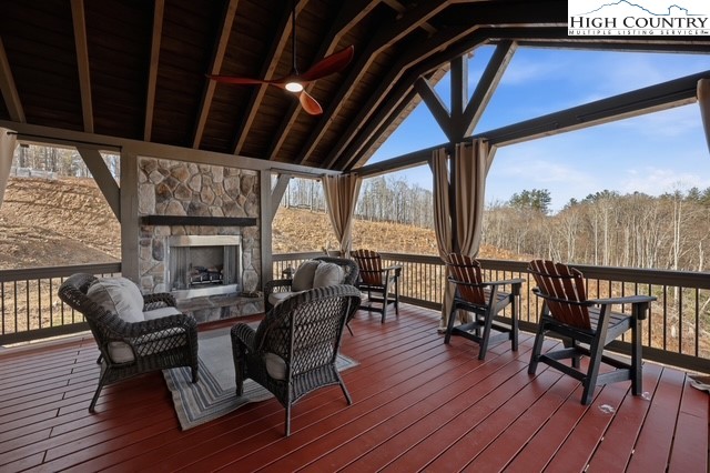 457 Autumn Leaf Way Crumpler, NC 28617 - Photo 34 of 37 a view of a chairs and table on the deck