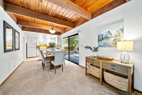 a dining room with furniture and window