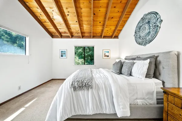 a bedroom with a bed and a table