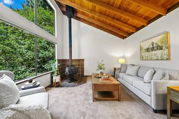 a living room with furniture and a table