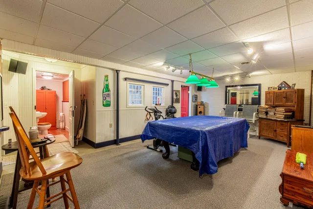 a bed room with furniture and a flat screen tv