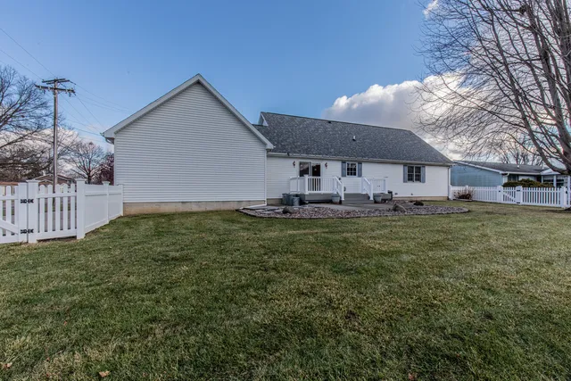 a front view of house with yard and seating area